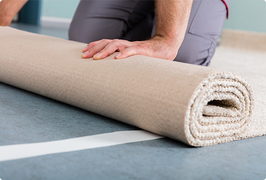 Rolling up Carpet for Water Restoration